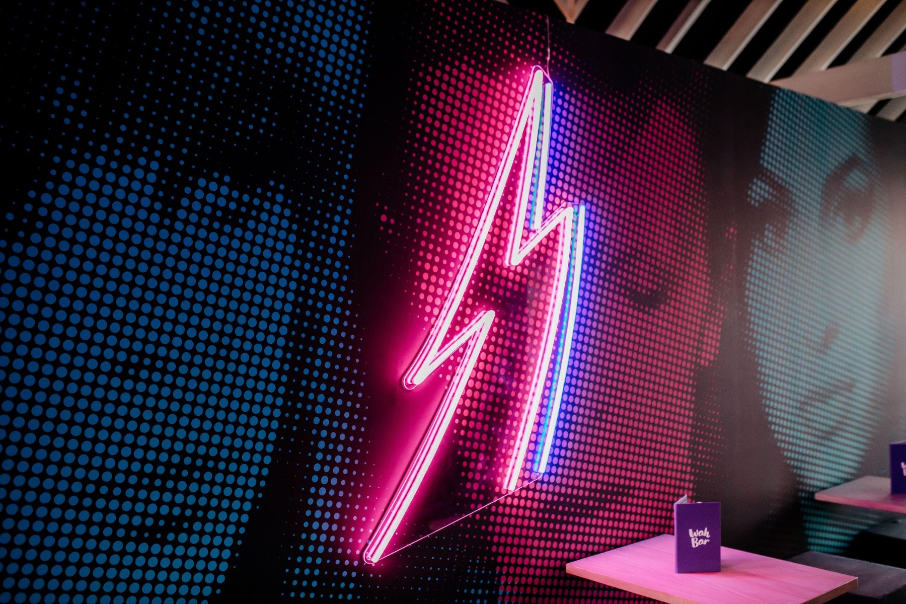 Pink and blue lightning bolt on Bowie inspired wall Custom Neon® for @wahwahgee
