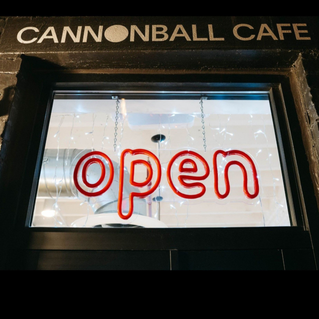 Red outdoor Custom Neon&reg; open sign in the window @cannonballcafebos