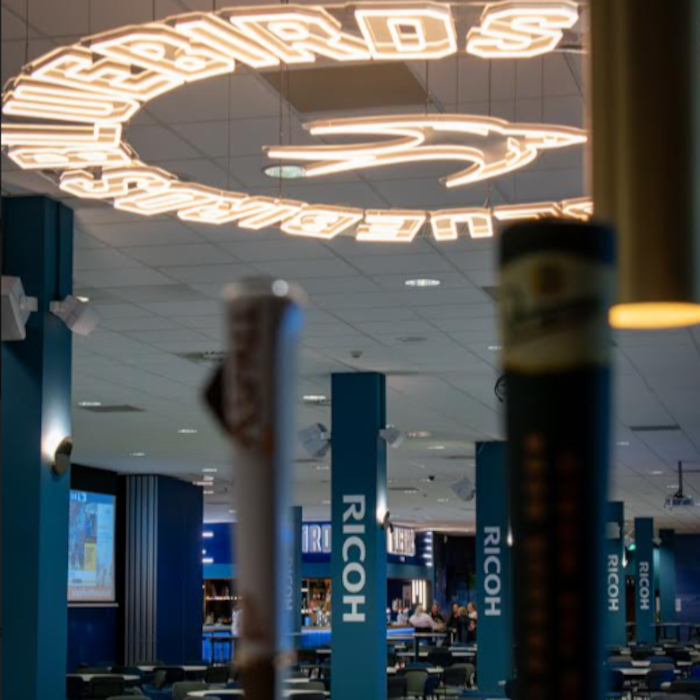 Custom Neon® suspended Bluebirds logo sign in the Cardiff FC VIP Lounge