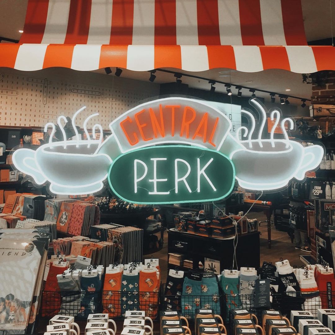 Custom Neon® LED neon and UV print Central Perk sign above the retail merchandise @typoshop