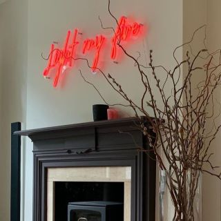 Light My Fire red Custom Neon® sign above the living room fireplace @charlottelilford