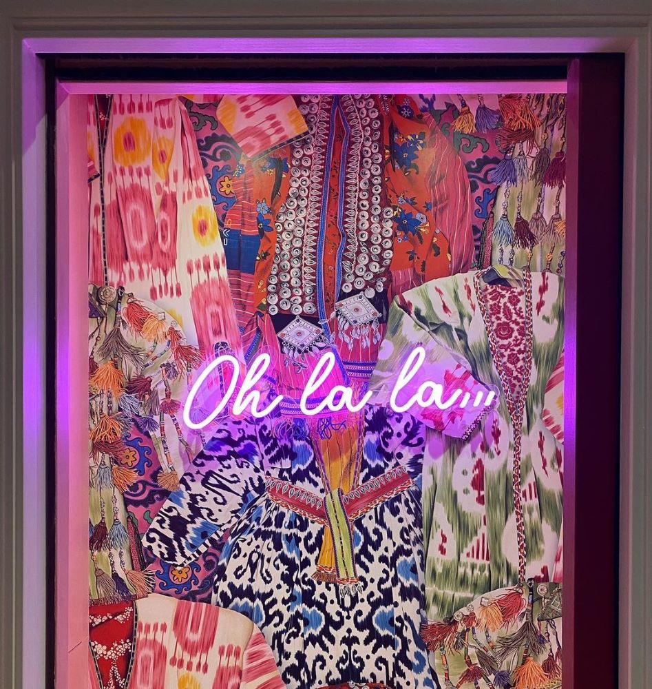 ohlala... pink Custom Neon® sign mounted on an artwork @charlottelilford