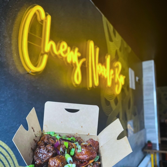 Yellow Custom Neon® restaurant name sign @chewsnoodlebar
