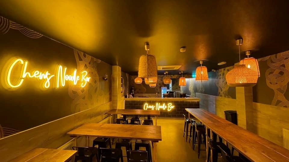 Custom Neon® golden yellow restaurant name signs @chewsnoodlebar