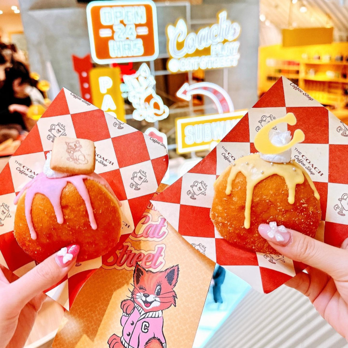 Custom Neon® signs in background of a selfie sign taken in the Coach Cafe at Coach Play @Cat Street @coach_japan photo by @apichu001