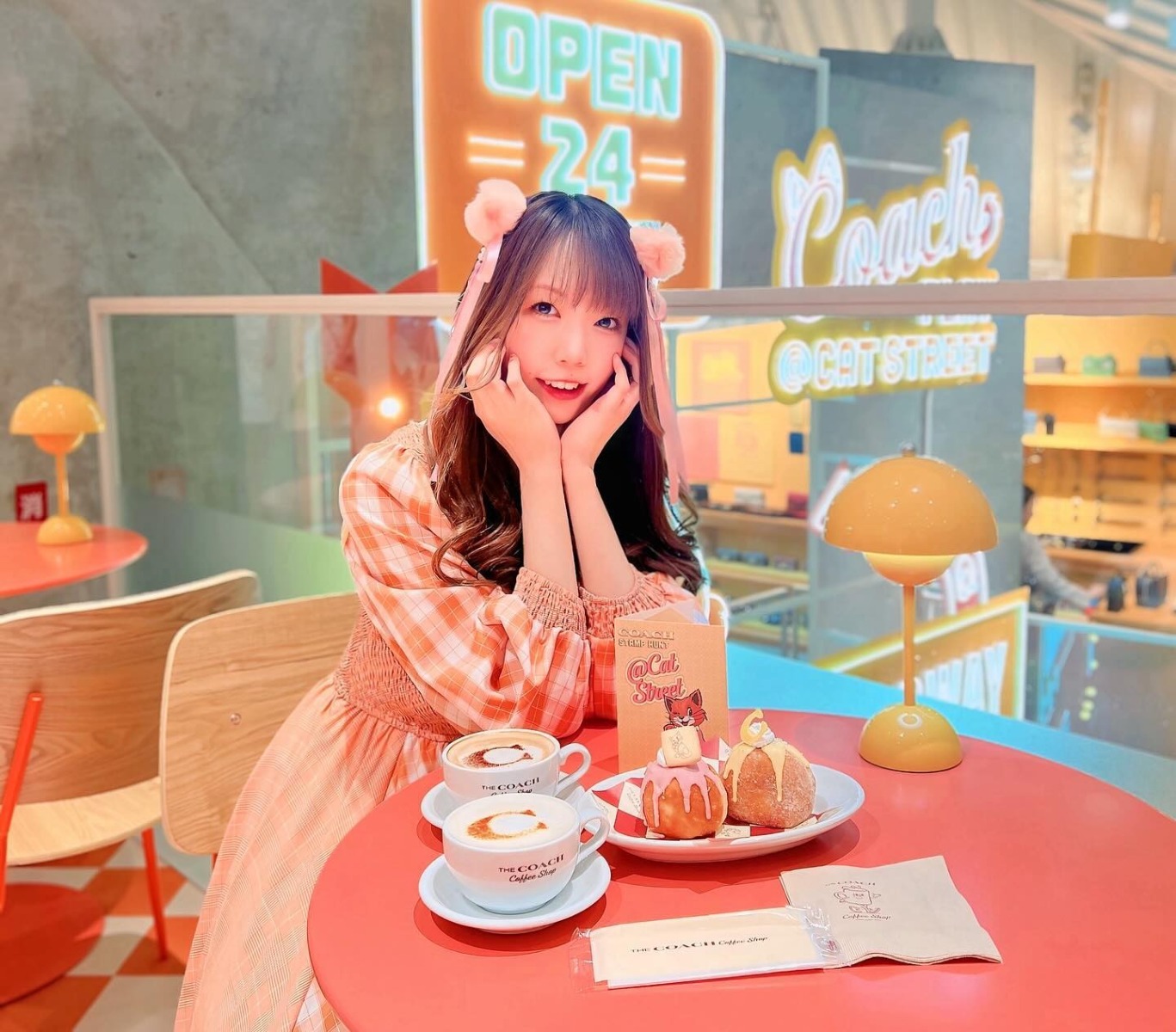 Selfie taken in the Tokyo Coach coffee shop with Custom Neon® signage in the background