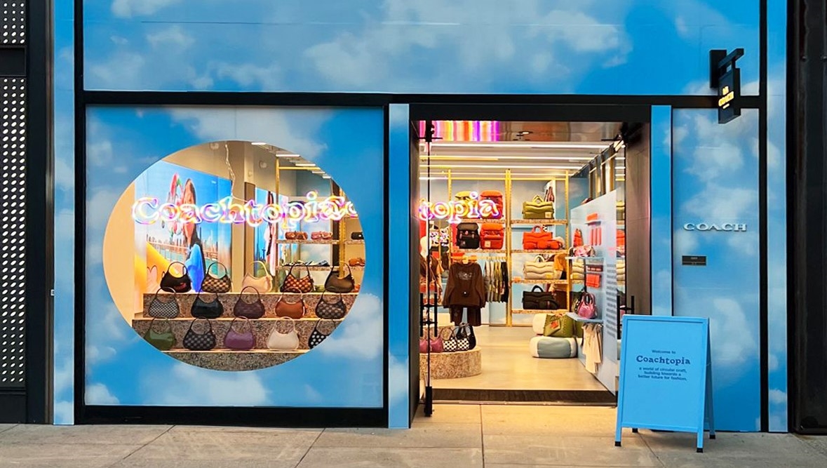 Coachtopia sustainable Custom Neon&reg; retail sign in the window of the original @coach store in New York