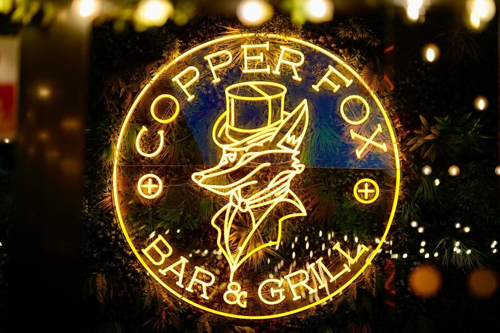 Copper Fox Bar and Grill circular logo in yellow LED neon flex