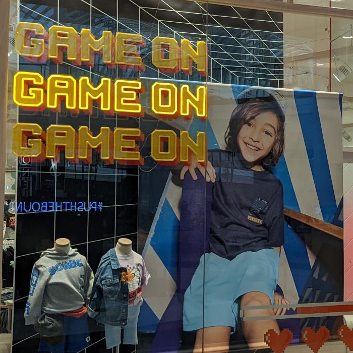 Custom Neon® animated storefront window sign @cottononkids