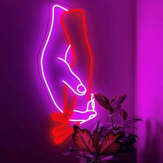 Neon sculpture of holding hands @marcushinneberg made by Custom Neon®