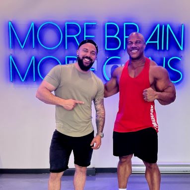 More Brain More Gain large blue Custom Neon® sign on white wall in the gym @educationquantum