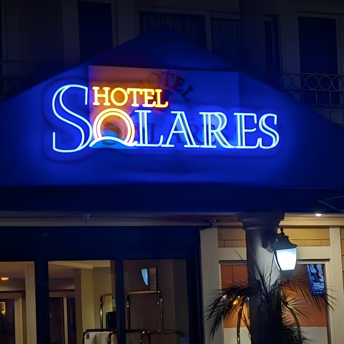 Custom Neon® exterior @hotel_solares logo sign above the entrance