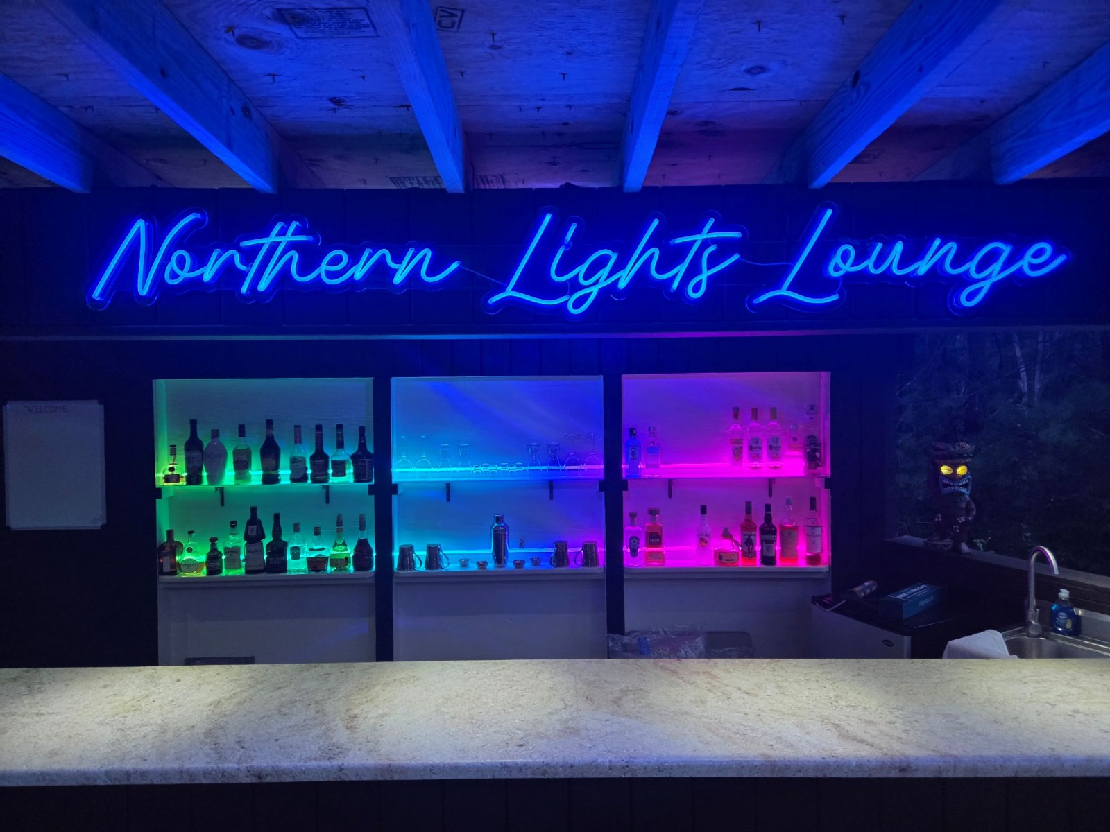 Northern Lights Lounge Custom Neon® color changing outdoor bar sign set to blue