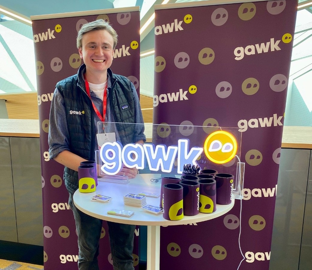 Gawk logo Custom Neon® UV Printed trade show free-standing sign with an acrylic base
