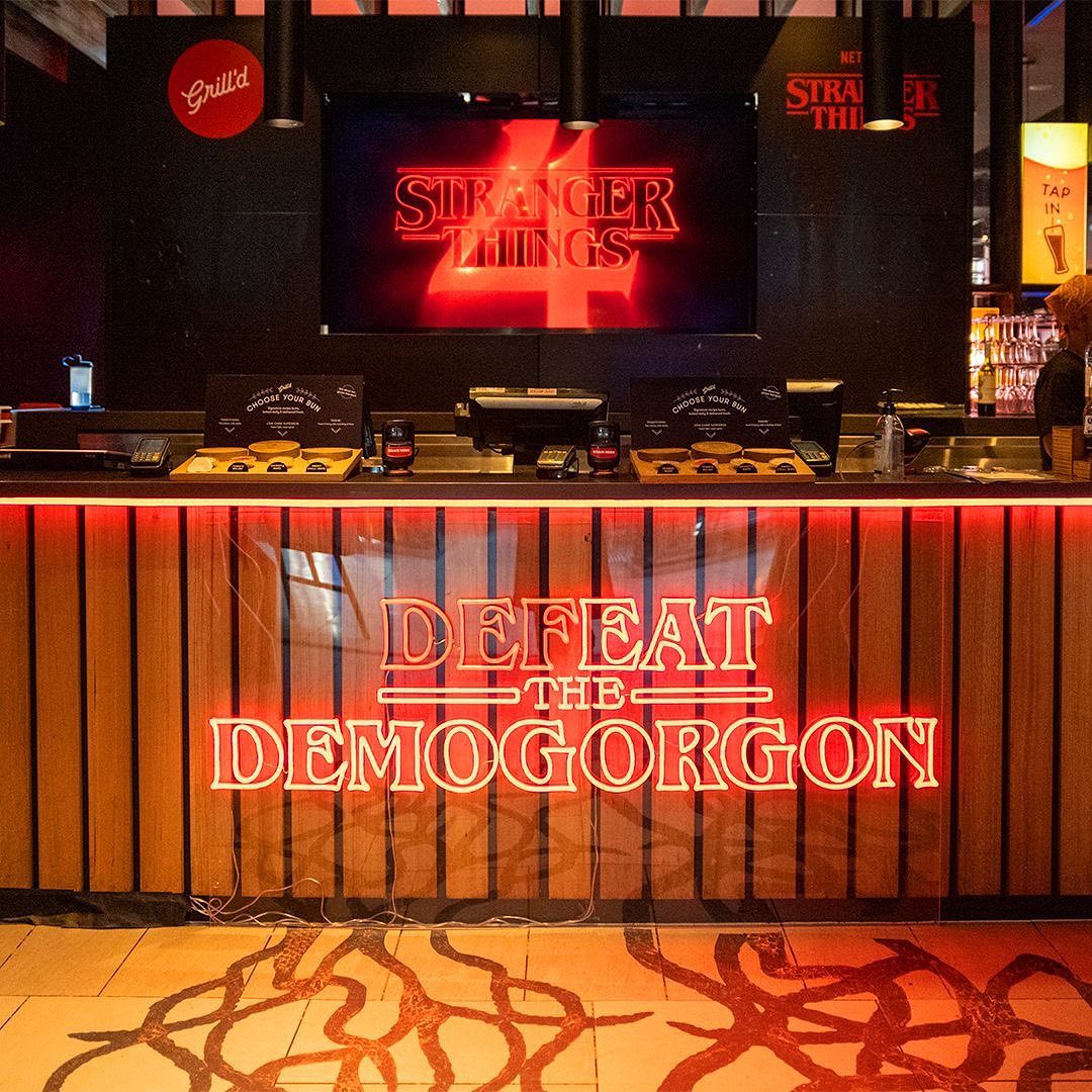 Custom Neon® red Defeat the Demogorgon sign for Netflix x Grill'd retail promotion @grilldburgers @seekeragency