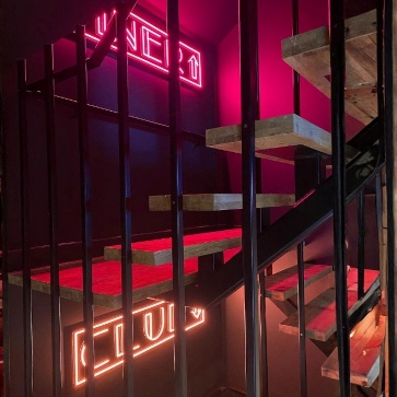 Multicoloured directional signage by Custom Neon® @johnevansinteriordesign