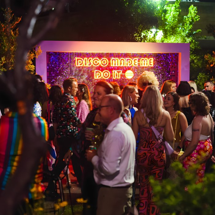 Disco Made Me Do It waterproof Custom Neon® on a shimmer wall during an outdoor event organised by @ultimo_catering and eventconceptmanagement&catering
