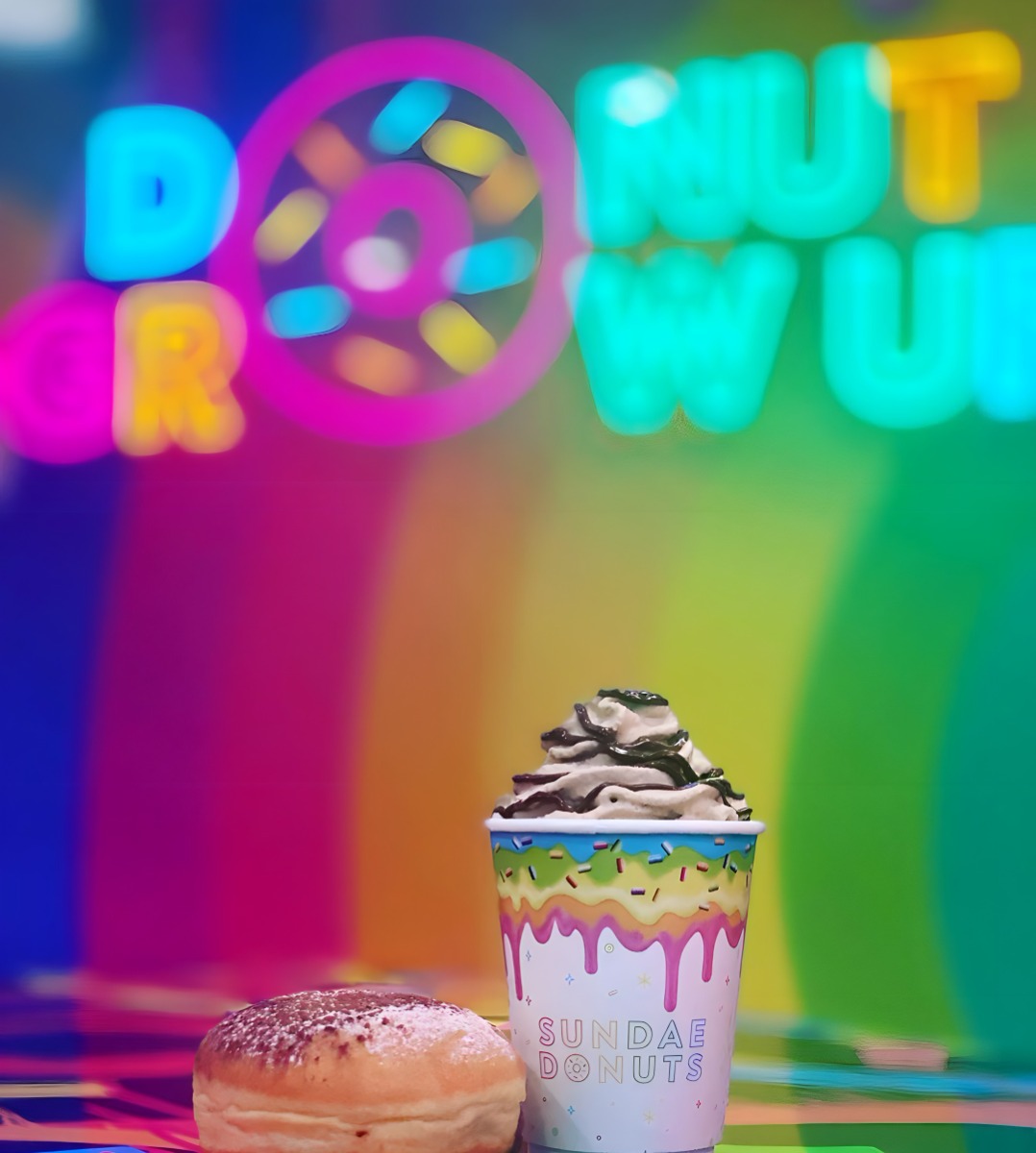 Custom Neon® colorful Donut Grow Up tagline sign @sundaedonuts