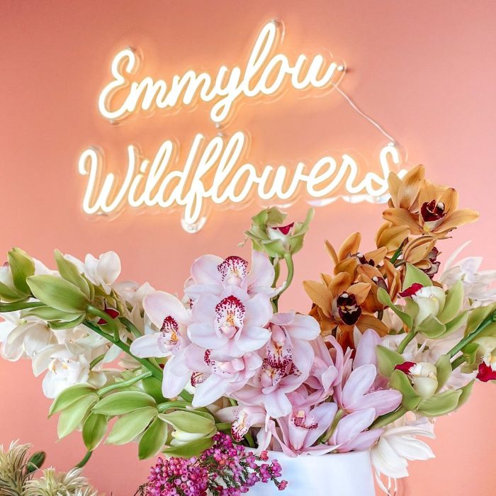 Custom Neon® sign in a script font for a boutique florist @emmylouwildflowers