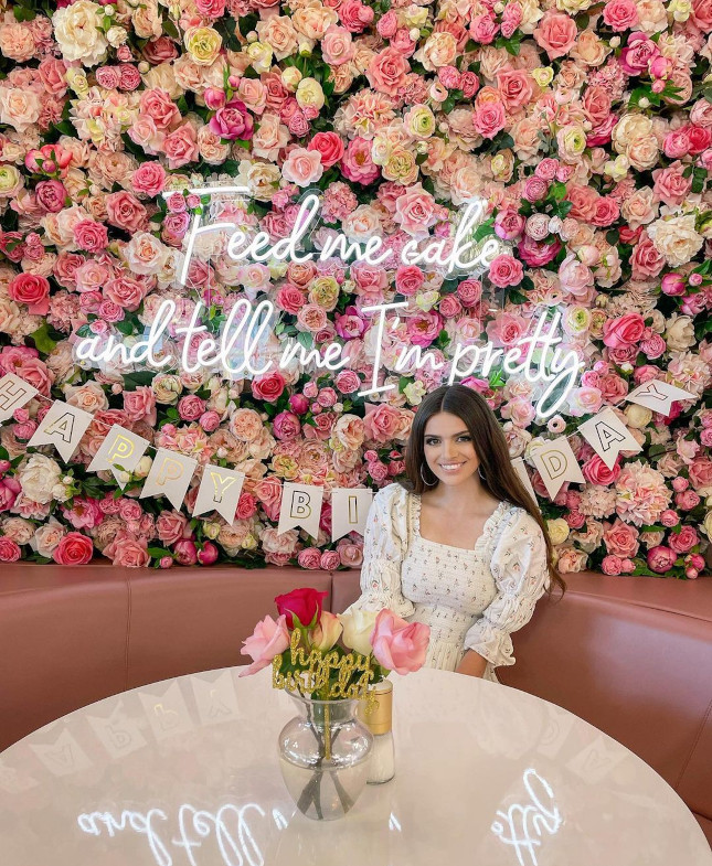 White Custom Neon® quote signs on floral walls @plateddreamscafe