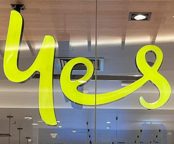 Yellow front lit window sign