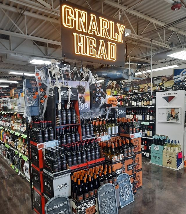 Gnarly Head wines logo made by Custom Neon® directing shoppers to the Gnarly Heads beverage display in a store @gnarlyhead