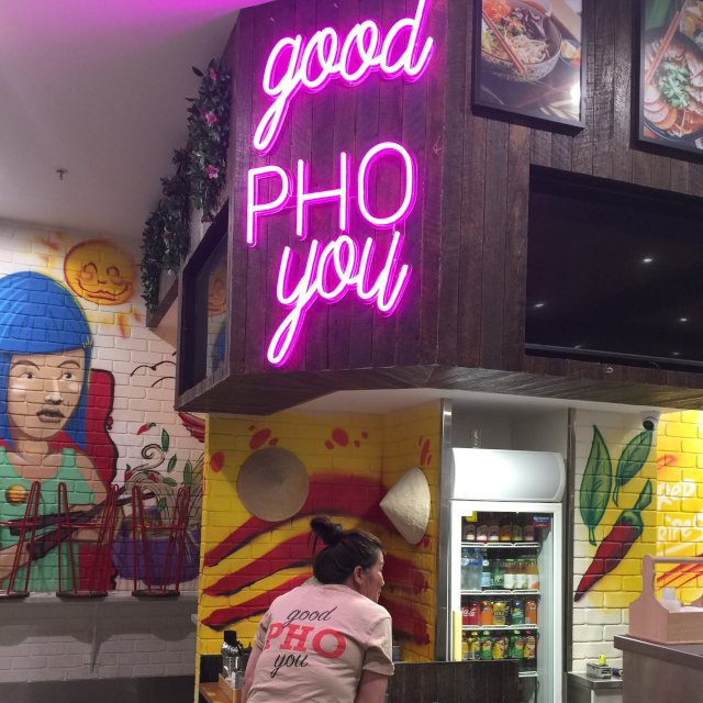 Good Pho You Custom Neon® made pink slogan sign in the @threeredstripespho Thai restaurant