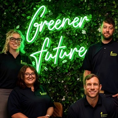 Custom Neon® green business name sign on greenery wall @greenerfuturesolar