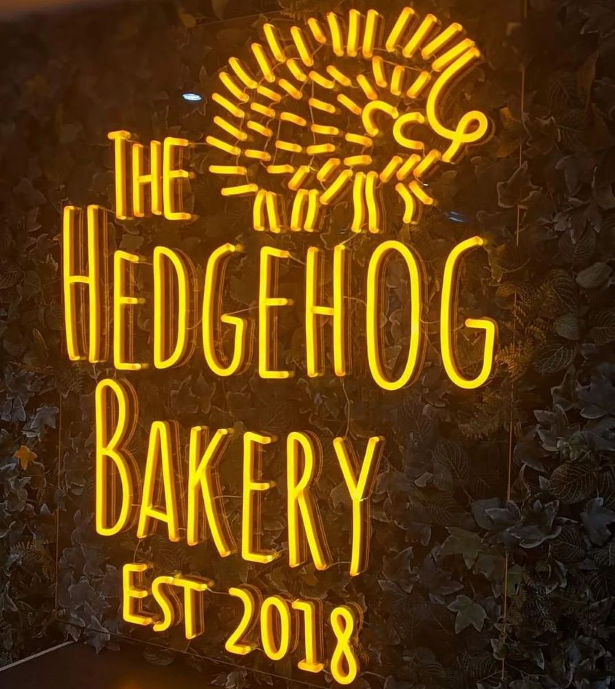 Orange hedgehog bakery logo by Custom Neon®@hedgehogbakery