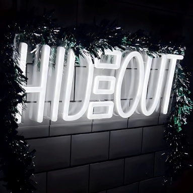 White Custom Neon® logo sign made for @hideout.barbers