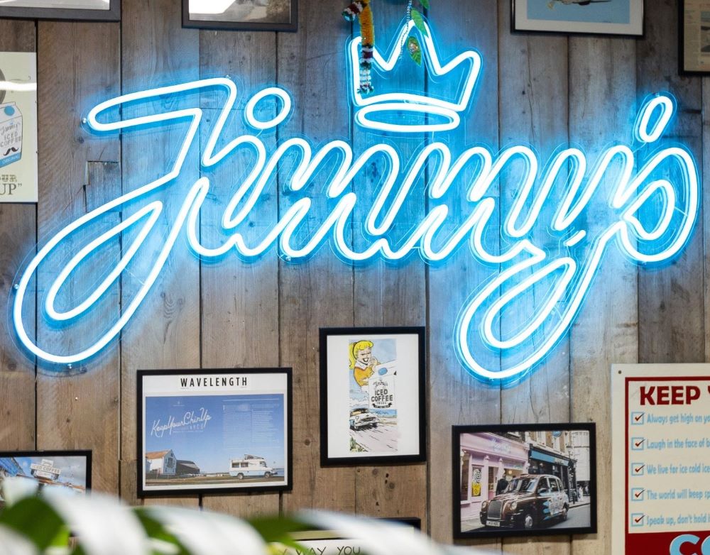 Custom Neon® logo in tropical blue @jimmysicedcoffee