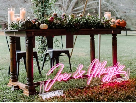 Custom Neon® pink wedding name sign in acrylic stand @marlayna_photography