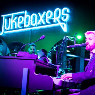 Blue Custom Neon® live music venue logo @jukeboxers