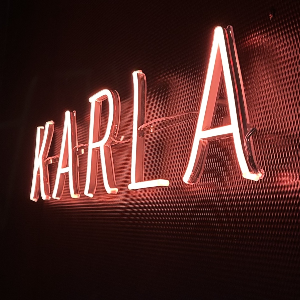 Karla restaurant name sign in red LED with a Naked Neon backing