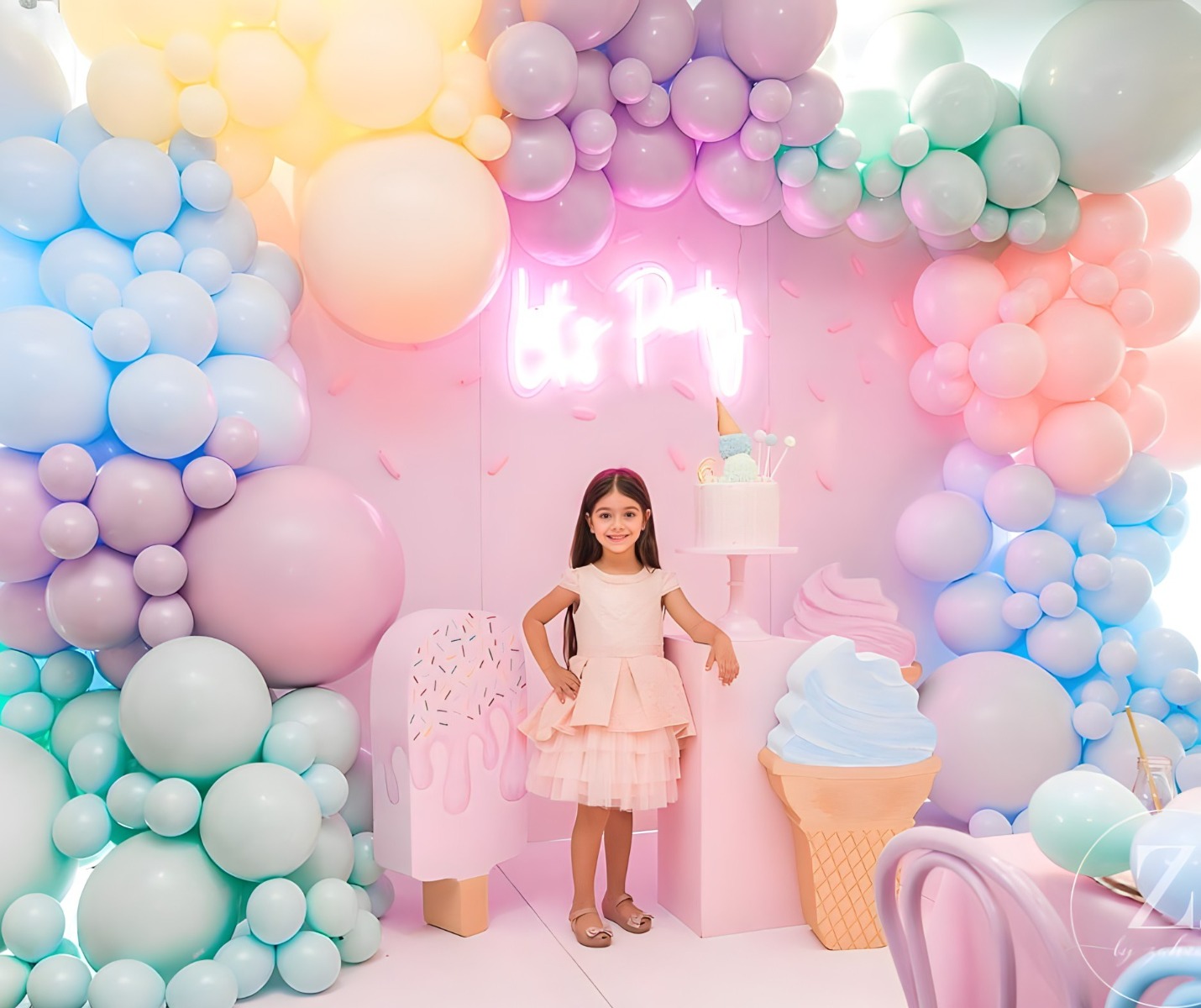 Let's Party Custom Neon® kids party photo wall backdrop sign on a pink wall surrounded by pastel balloons and decorations