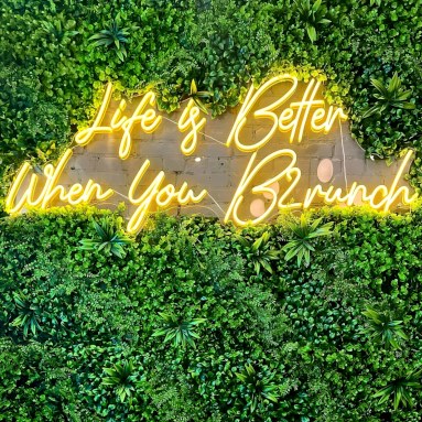 Life is better when you brunch yellow Custom Neon® quote sign on grasswall @brunchharlem