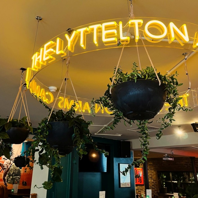 Custom Neon® circular pub sign suspended from the ceiling @lytteltonarms