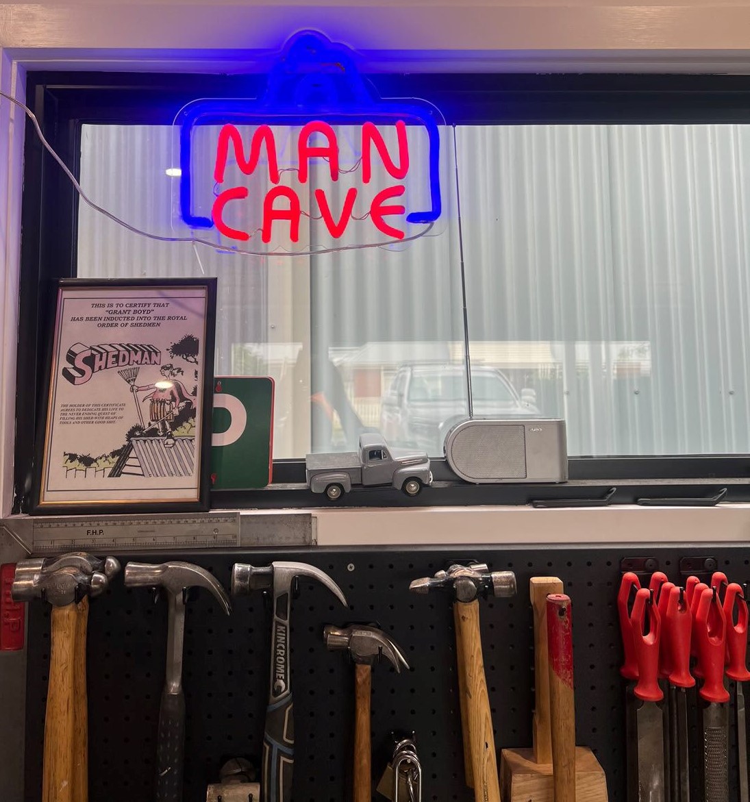 Custom Neon® man cave sign in a tool shed