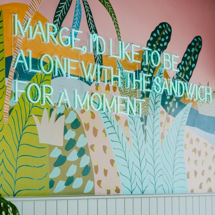 Custom Neon® mint green LED sign on clear acrylic cut to letter