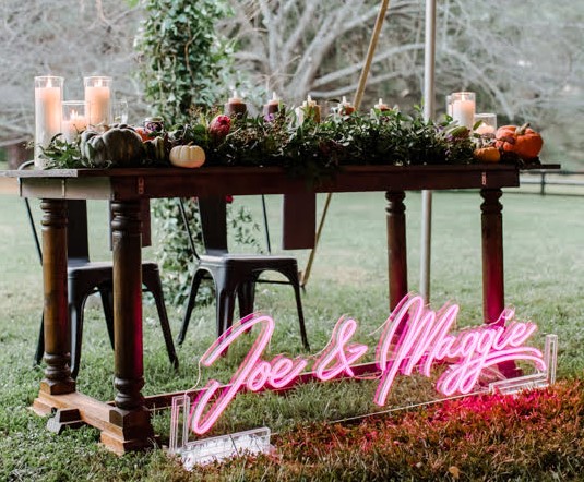 Custom Neon® pink wedding name sign in acrylic stand @marlayna_photography