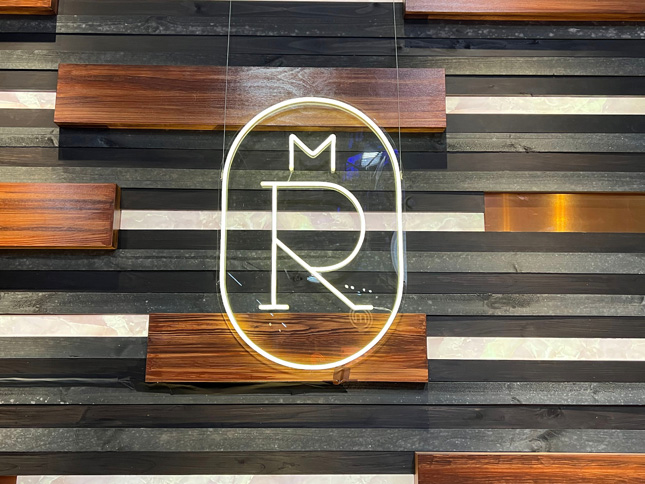 Melbourne Royal Show logo in white LED neon flex on wood panelled wall made by Custom Neon®