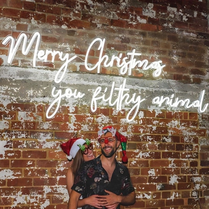 Large white Christmas movie quote sign by Custom Neon®