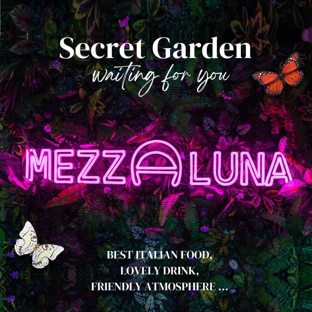 Custom Neon® pink restaurant name sign in the secret garden @mezzalunabristol