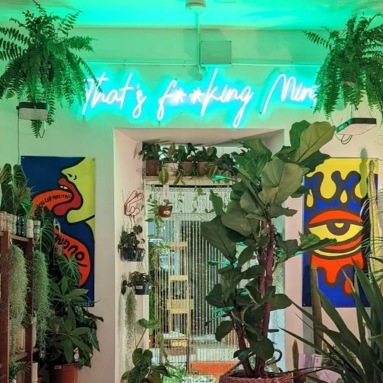 Custom Neon® green tagline sign for retailer @mint.plants