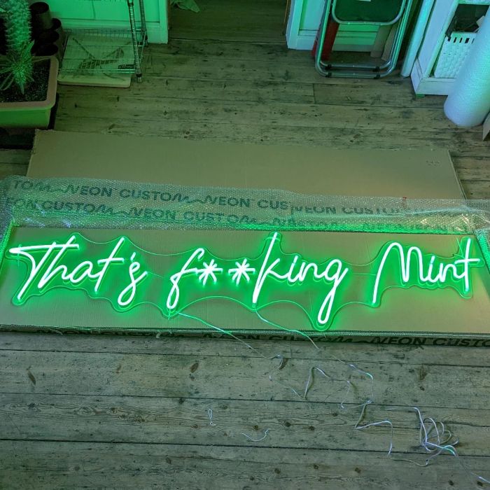 Thats F--ing Mint green LED Custom Neon® sign on the floor being unboxed