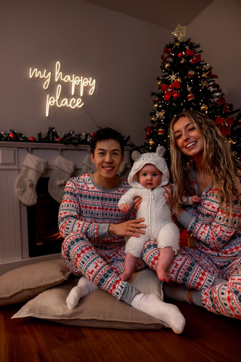 Custom Neon® My Happy Place sign above the mantlepiece on Christmas morning