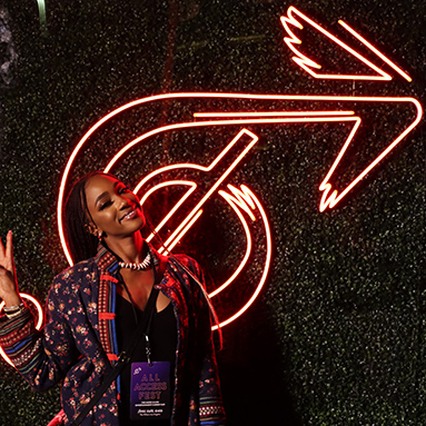 Custom Neon® arrow logo sign outdoors