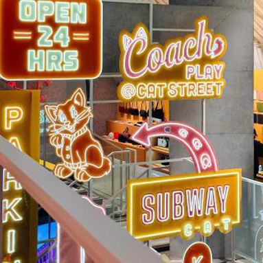 Custom Neon® retail display signs in the Coach Play at Cat Street store