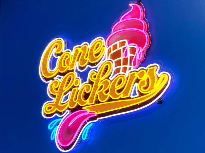 Custom Neon® LED neon & UV print ice cream parlour logo sign on deep blue wall