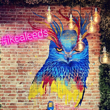 Custom Neon® pink Ikea Leeds hashtag sign on brick wall at the entrance to the Leeds Ikea store